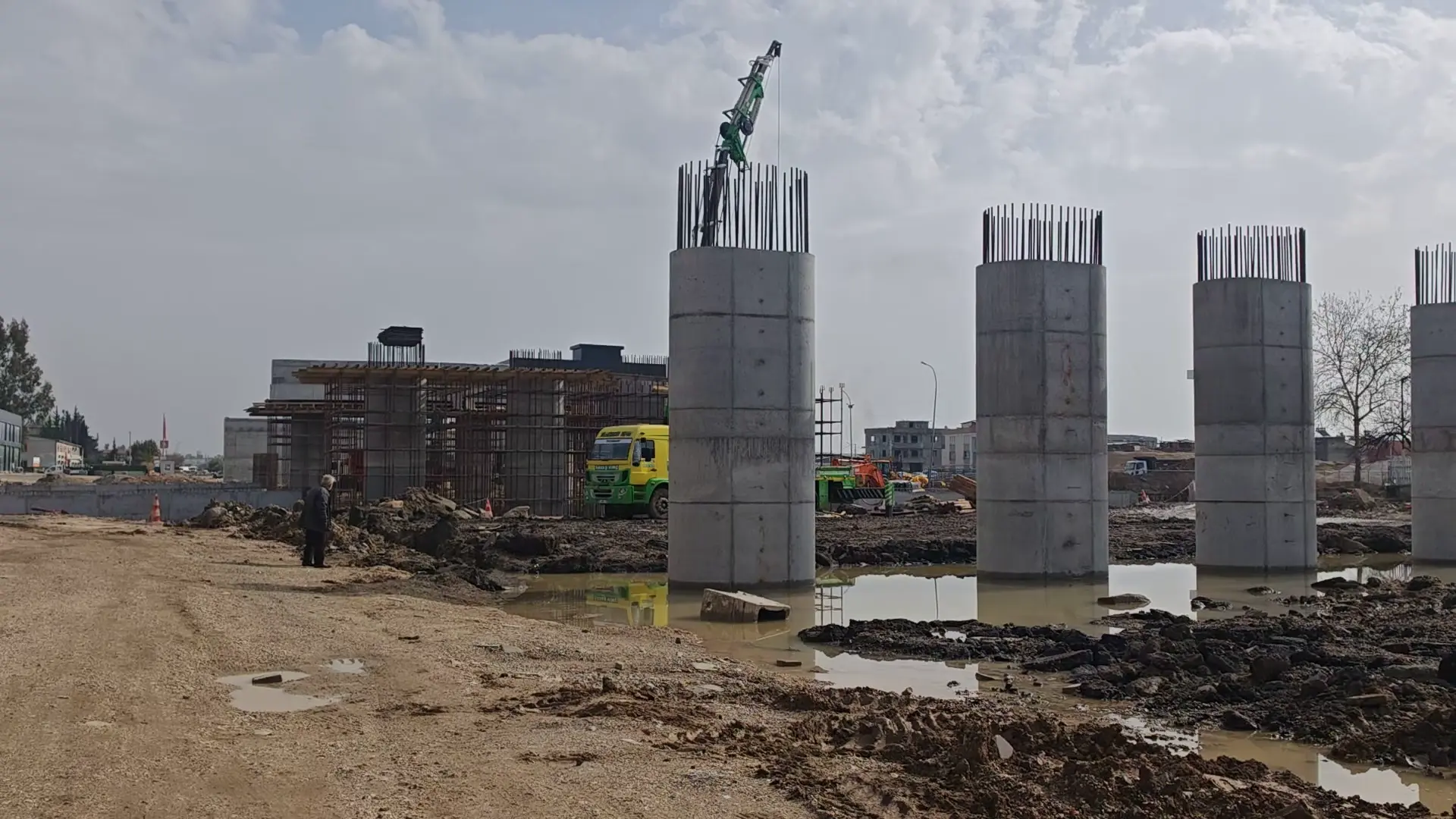 Concrete columns and site equipment on a construction project